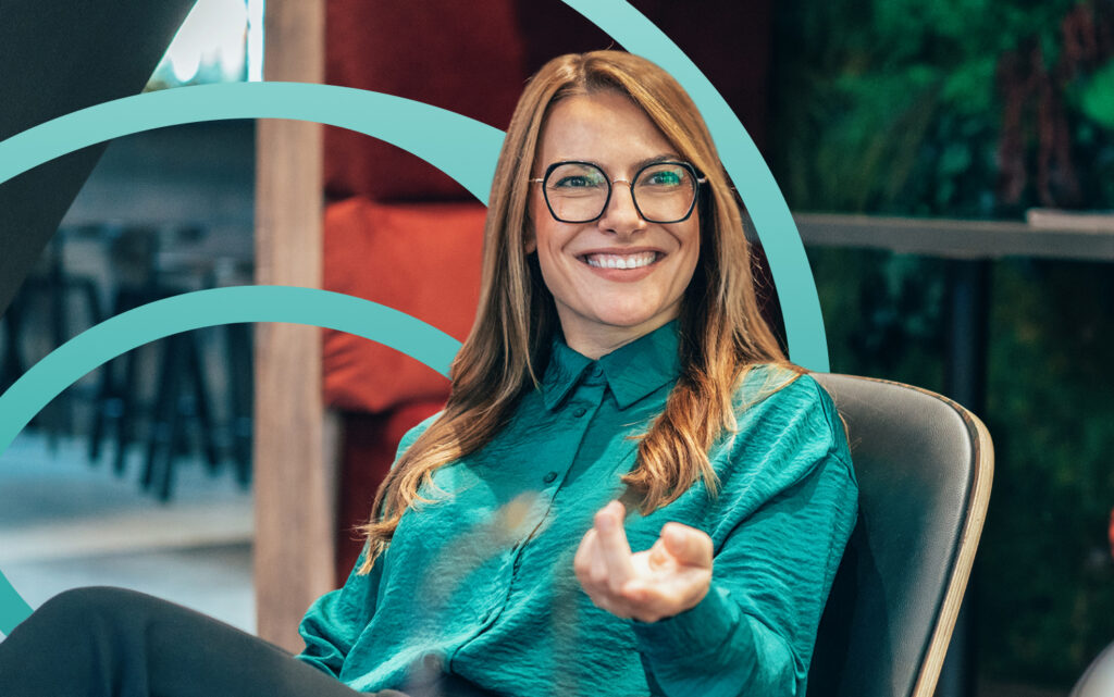 woman smiling with hand out